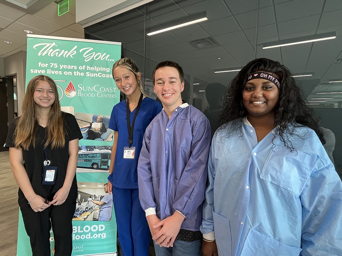 Lakewood Ranch High School's Maya Gilkison, Maya Kopija, Isaiah Schulz and Ryniah Milner work in the blood lab at SunCoast Blood Centers.