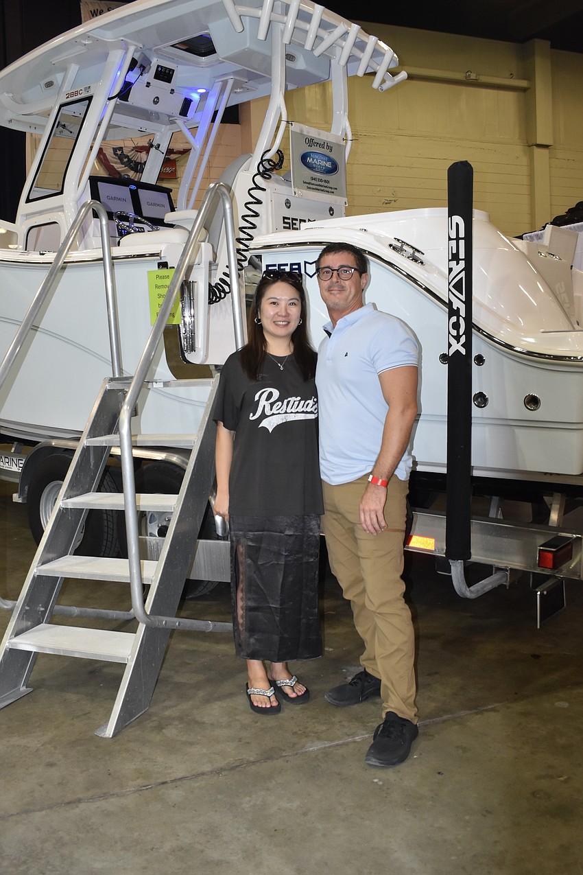 Ting Ting Fang and Darren Schwartz finish exploring one of the two boats provided by Suncoast Marine.