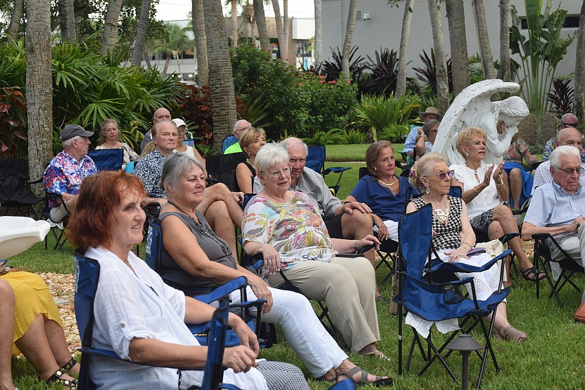 Music lovers from St. Armands Key Lutheran Church enjoy a jazz concert in its garden.