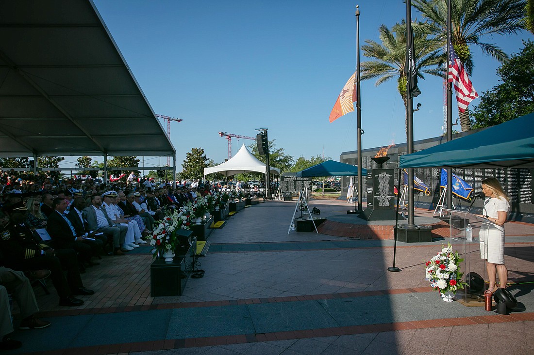 Jacksonville Mayor Donna Deegan speaks at the city's annual Memorial Day ceremony May 27. At left the crowd is shielded by a large, rented shade tent.