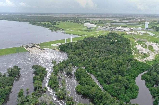 An aerial view of the Lake Manatee Dam shows water being released.