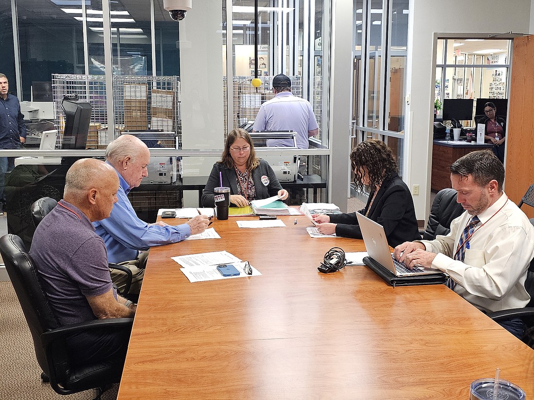 The 2024 Flagler County Canvassing Board. Clockwise from left to right: Alternate member Commissioner Donald O'Brien, Commissioner David Sullivan, Election Supervisor Kaiti Lenhart, board chair Judge Andrea Totten and county attorney Sean Moylan. Photo by Sierra Williams