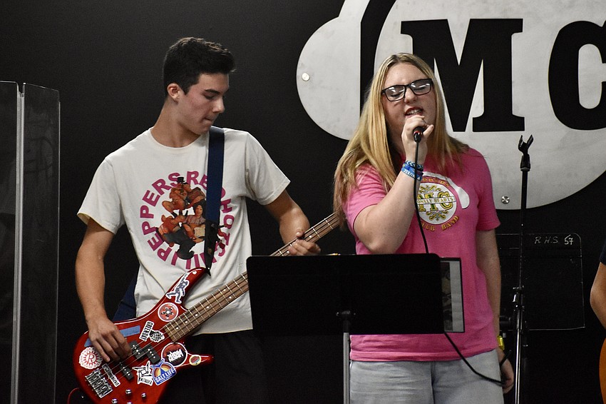 Luc Drage, 13 and Sophia Emmons, 14, perform with Solar Apocalypse.