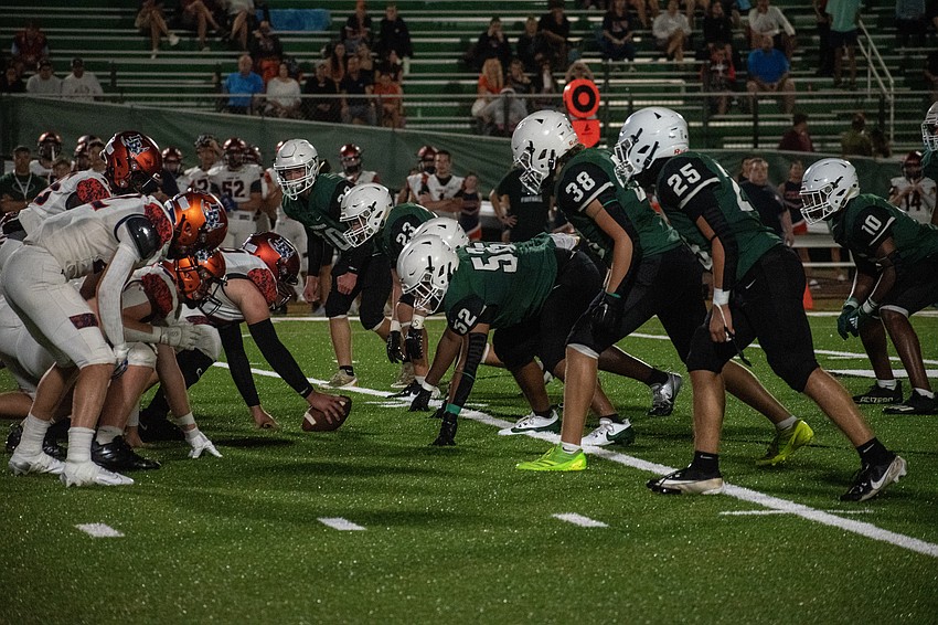 The Lakewood Ranch High defense bears down on Lemon Bay High. The Mustangs held the Manta Rays to 18 points, and zero in the second half.