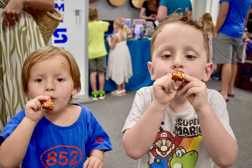 Leo Stuart, 3 and Cash Radcliffe, 4, enjoy the party atmosphere.