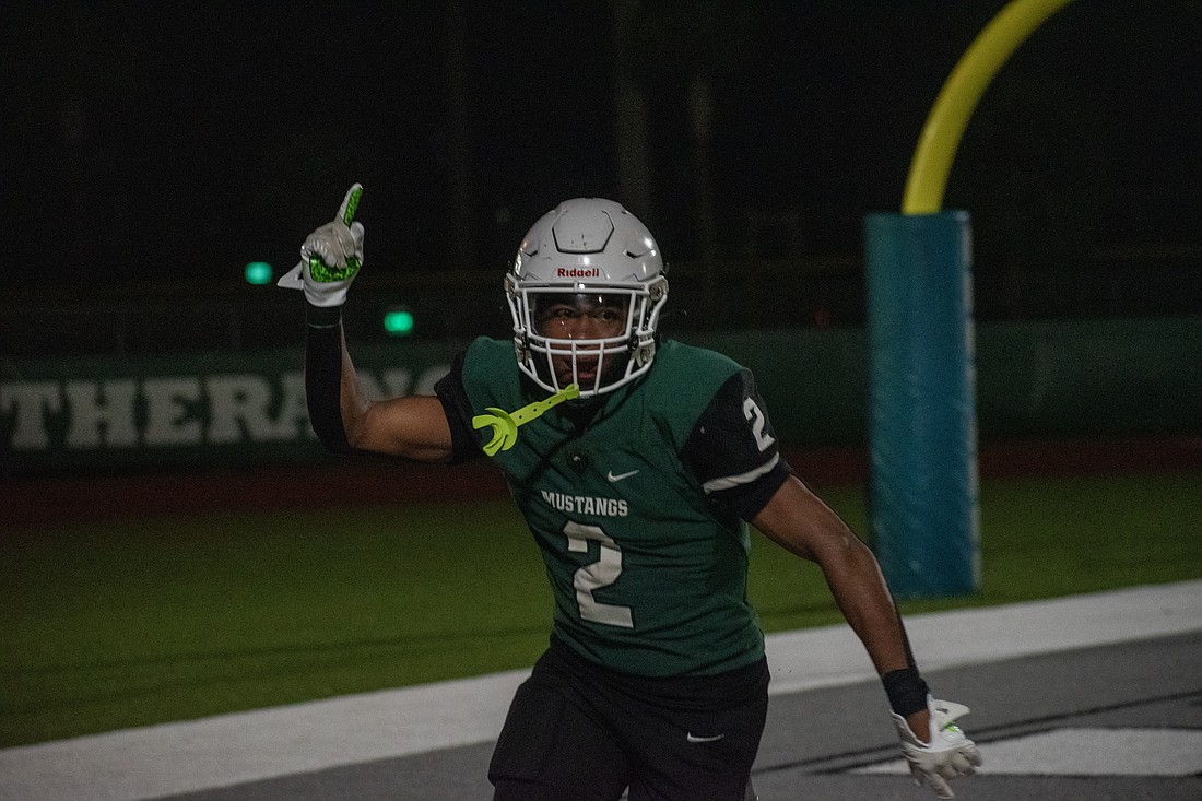 Lakewood Ranch senior Cullen McRae celebrates after his third touchdown run against Lemon Bay High.