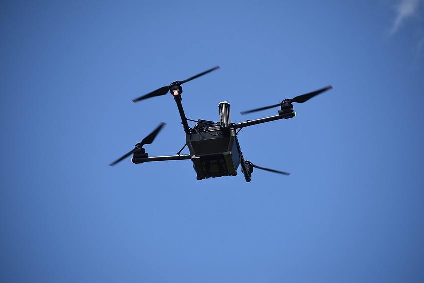 The Lakewood Ranch Business Alliance gets a demonstration of how the EMS drone drops a payload.