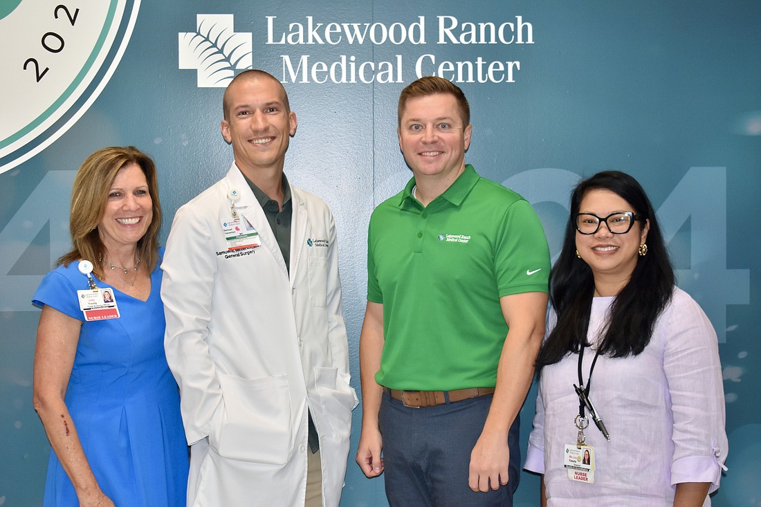 Chief Nursing Officer Judy Young, surgeon Samuel Yelverton, CEO Andy Guz and Director of Quality and Accreditation Malou Kaseta enjoy working at the Lakewood Ranch Medical Center together.