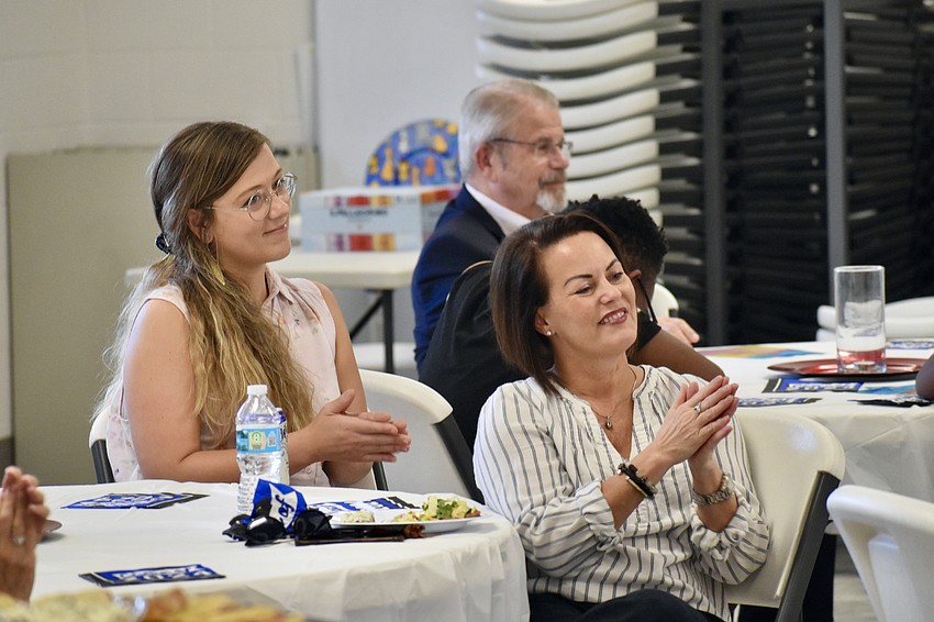 Lindsey Frost, Rabbi Stephen Sniderman and Christina Florand listen to a speech preceding the graduation.