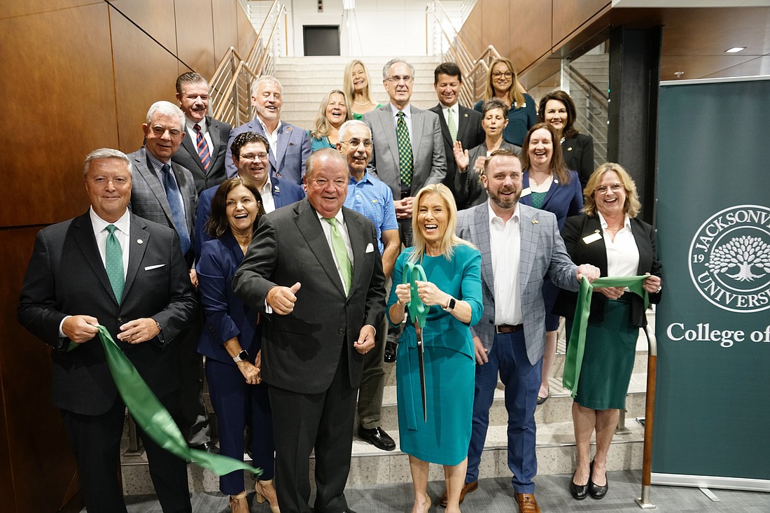 From left, front row, Jacksonville University President Tim Cost, JU interim Provost Sherri Jackson, JU College of Law Dean Nick Allard, Jacksonville Mayor Donna Deegan, City Council Vice President Kevin Carrico and JU College of Law Vice Dean Margaret Dees cut the ribbon to ceremonially open the law school.