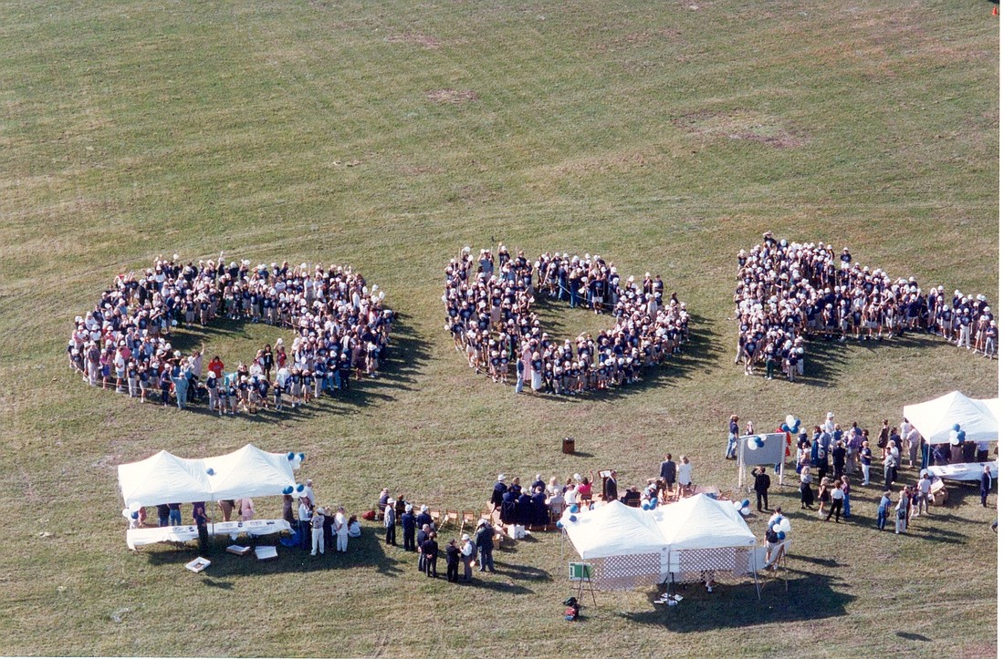 Faculty and staff spell out "ODA" to celebrate the groundbreaking of The Out-of-Door Academy's upper school in 1995 in Lakewood Ranch.