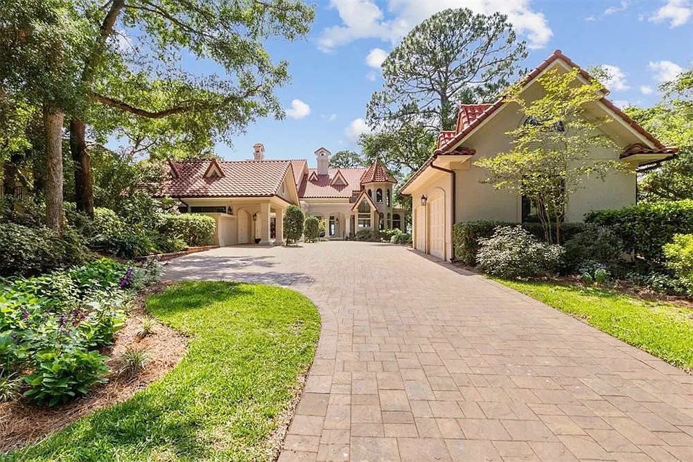 Intracoastal Waterway front two-story home on Amelia Island. Features five bedrooms, five bathrooms, screened porch, patio, guest house and dock.