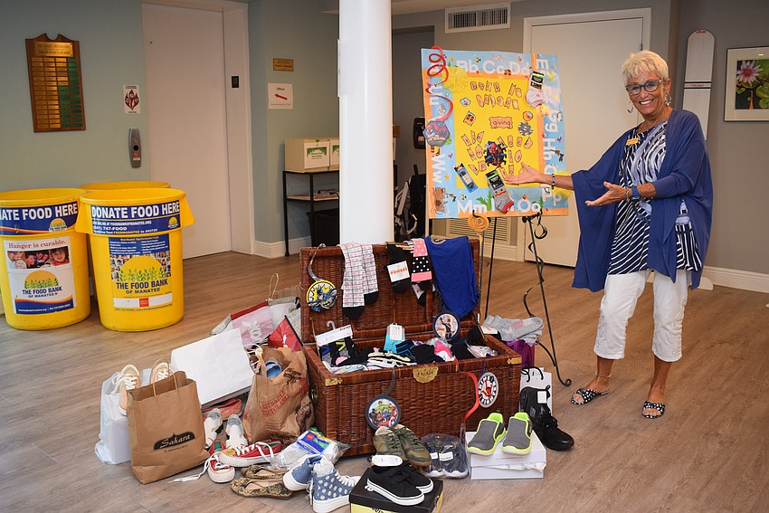 Connie DiMaggio with the donations for Turning Points at the August Gather and Give.