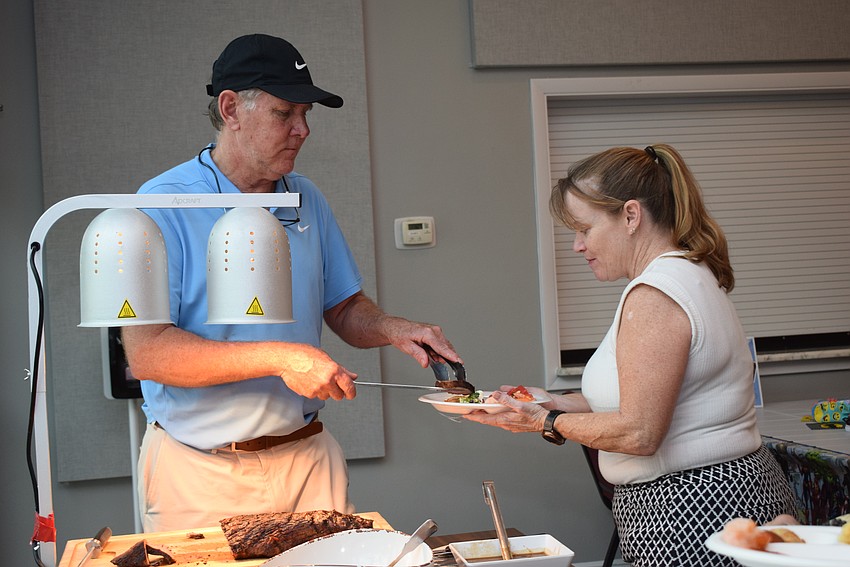 David Stone and Carolyn Nielsen at the August Gather and Give at the Longboat Island Chapel.