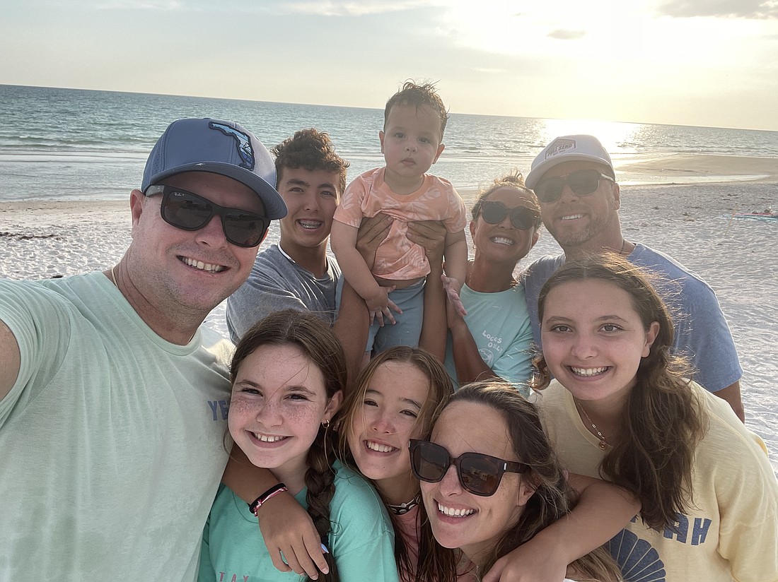 Bobby Burnett (left) and his family go to the beach with his brother Josh Burnett (right) and his family, who were visiting from Nicaragua. Bobby Burnett says his brother and his family have been tremendous support since his daughter Grace Burnett suffered from a brain aneurysm suddenly.