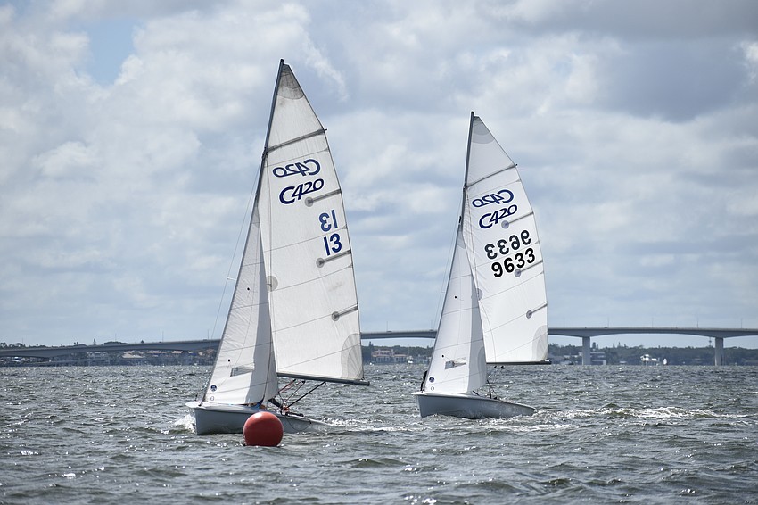 The boats of Alexander Getzels and Alexander Hryniewicz of Sarasota Youth Sailing and Harper Emerson and Ashley Korakis of Davis Island Race Team