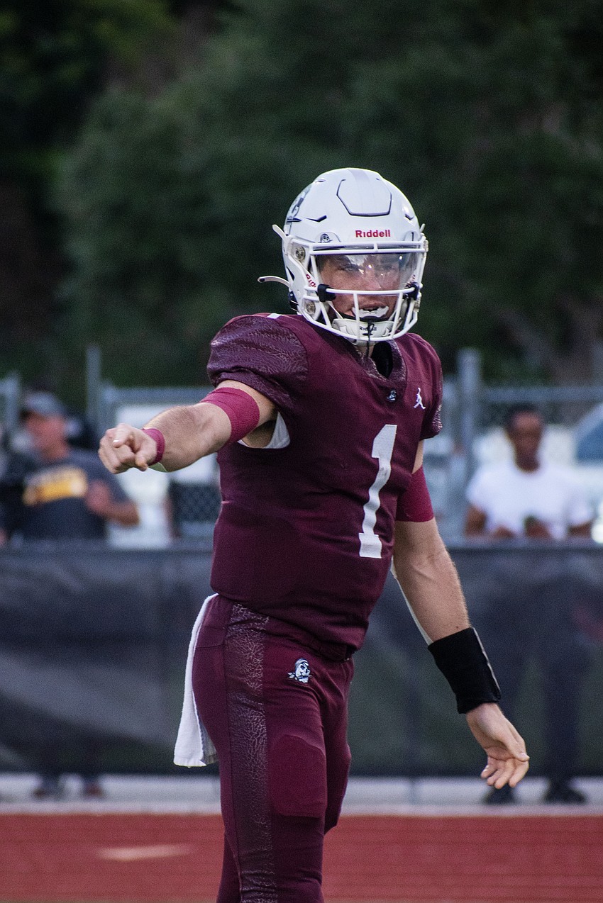 Braden River senior quarterback Lucas Despot gives directions to his wideouts.
