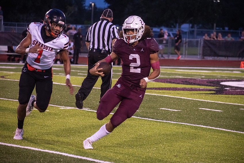 Braden River junior running back Julian Brown takes a carry against Sarasota up the field.