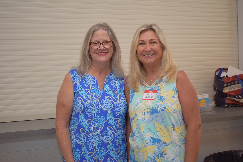 Maeve Northcross and Gina Spillers at Longboat Harbour's Labor Day party.