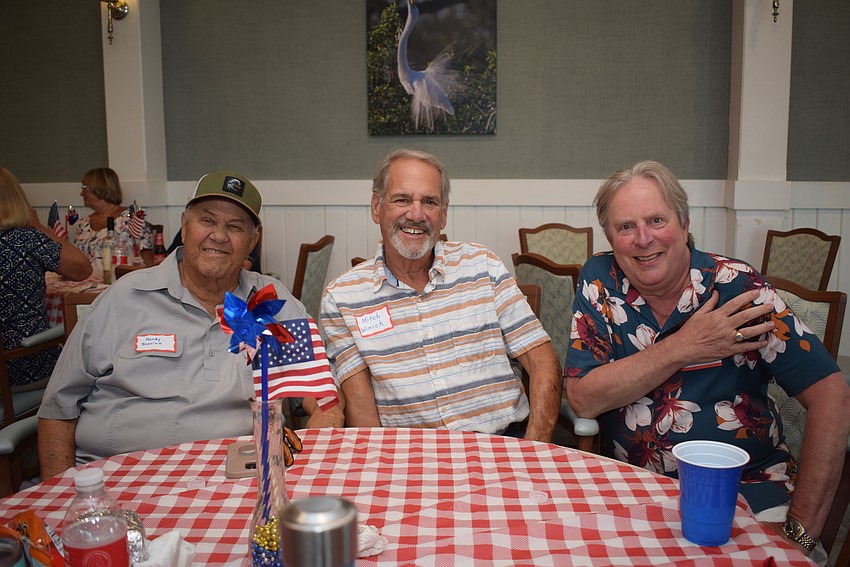 Randy Blevins, Mitch Winick and Art Gelber at Longboat Harbour's Labor Day party.