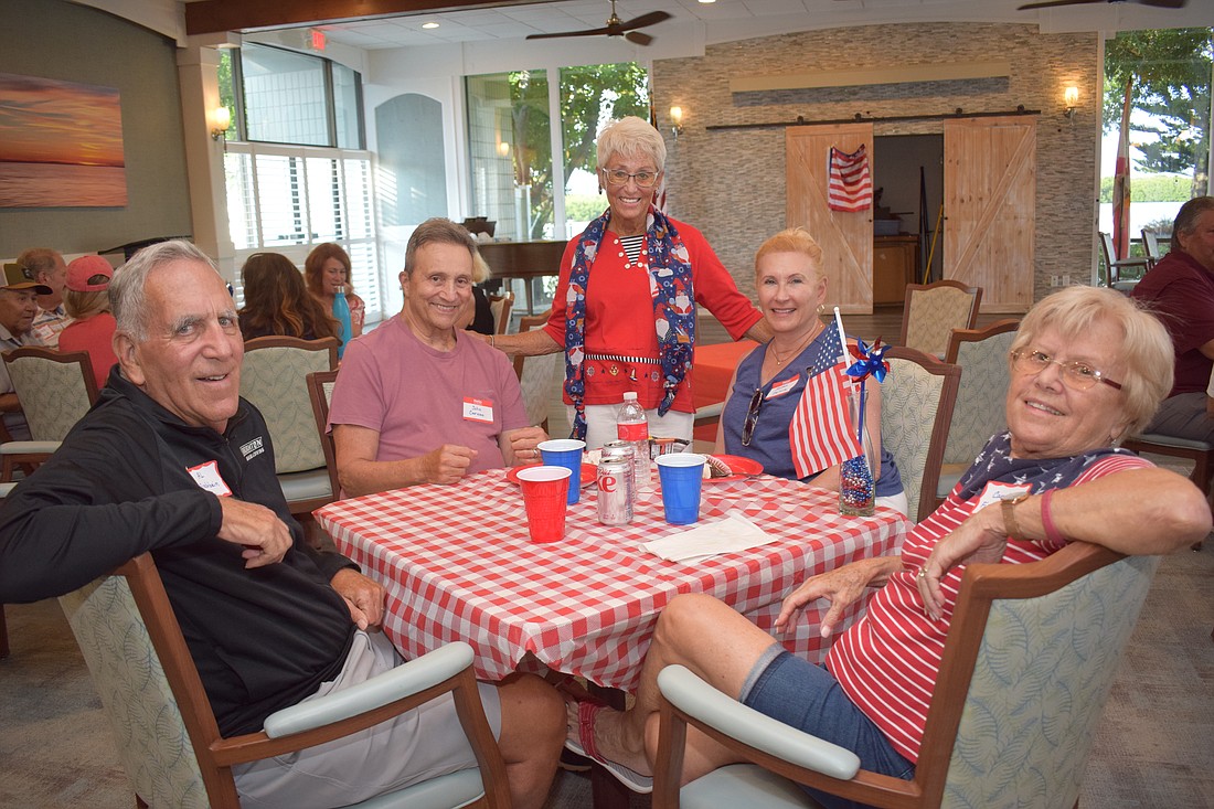 Al Fischbein, John Caruso, Connie DiMaggio, Susan D'Aloia and Carol Fischbein at Longboat Harbour's Labor Day party.
