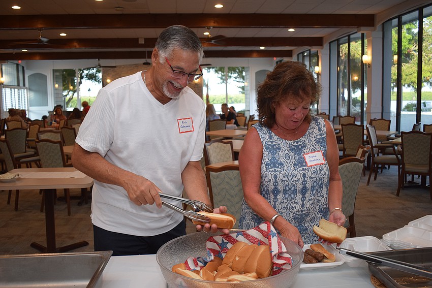 Rich Catapano and Joyce Hecklau at Longboat Harbour's Labor party.