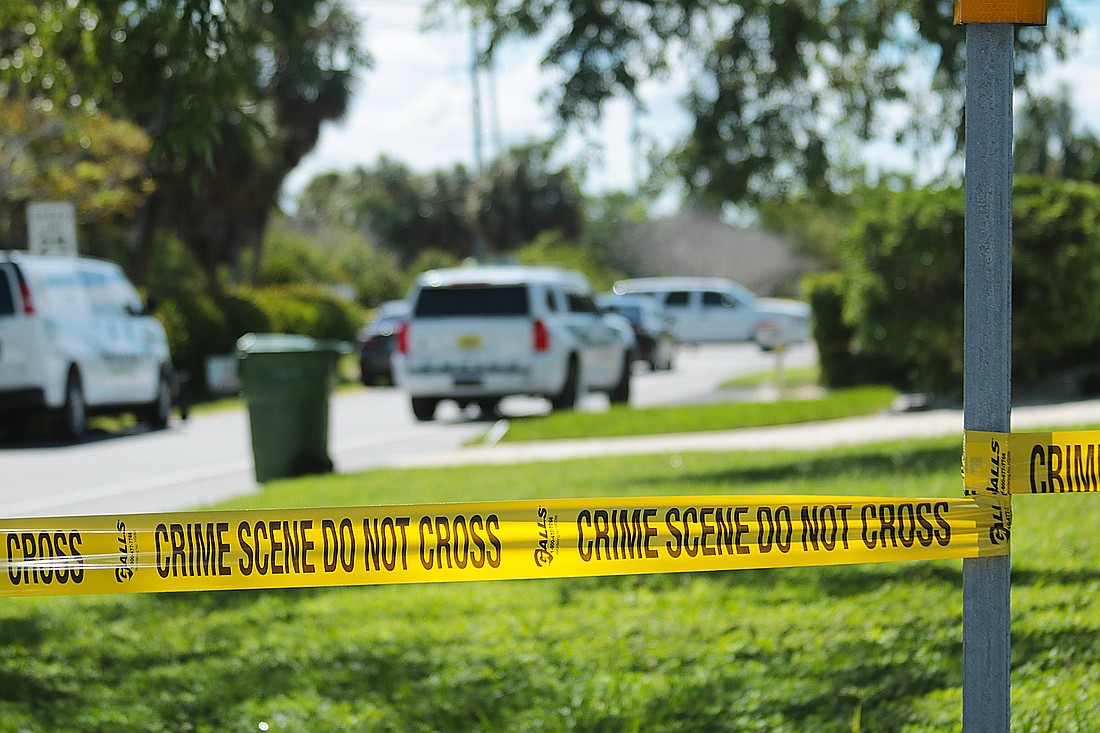 Crime tape surrounds the home at 722 S. Boulevard of the Presidents on Lido Key Sept. 3. Two men were found dead at the home which was operating as an Air B&B, police said.