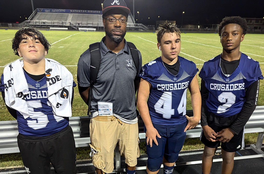 Angel Bass-Gutierrez, coach Dell Arneaud, Gabe Gibson and Mari Arneaud. Photo by Brent Woronoff