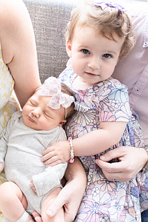 Blaire holds her new baby sister Brynn Rosemary Slansky.