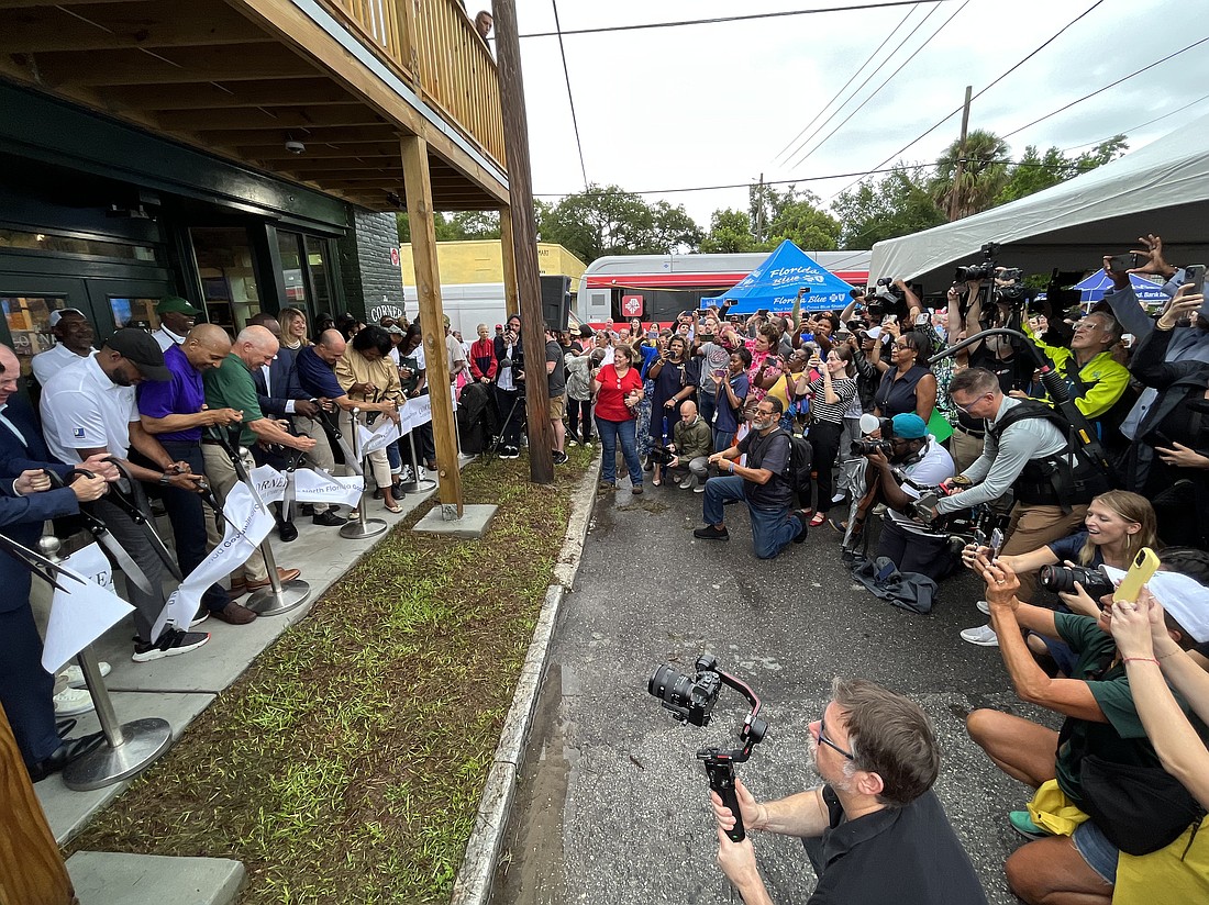 More than 100 Eastside residents gathered for the opening of The Corner at Debs, the restored grocery store at 1478 Florida Ave., north of the Sports Complex.