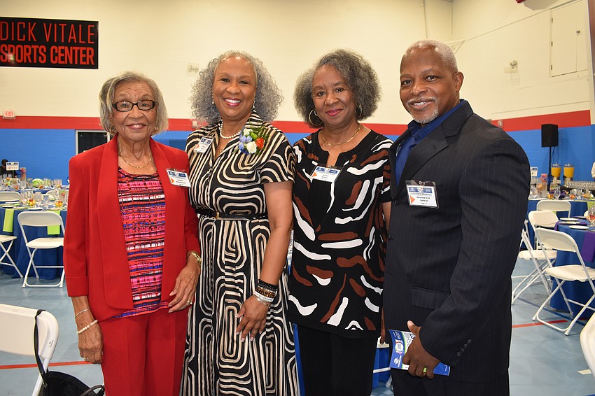Harriet Moore's (second from left) family attended the event including her mother Estrella Moore-Thomas, sister Cynthia Hudson and pastor Reverend Dr. R. Smith IIII.