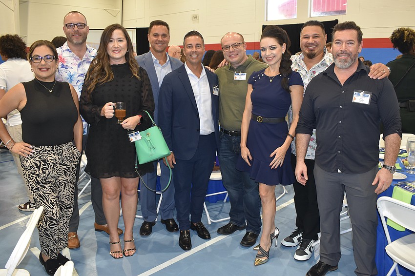 Valerie Padur, Rich Tyson, Valerie Jones, Paul Bachmann, Robert Milligan, Javi Vargas, Olga Ovchiyan, Frank Padur and Brian Chapman belong to the company Preferred SHORE Real Estate, an event sponsor.