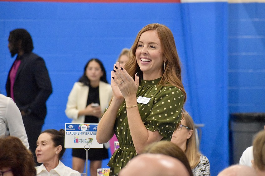 Boys & Girls Clubs Kaitlyn Perez applauds during the ceremony.
