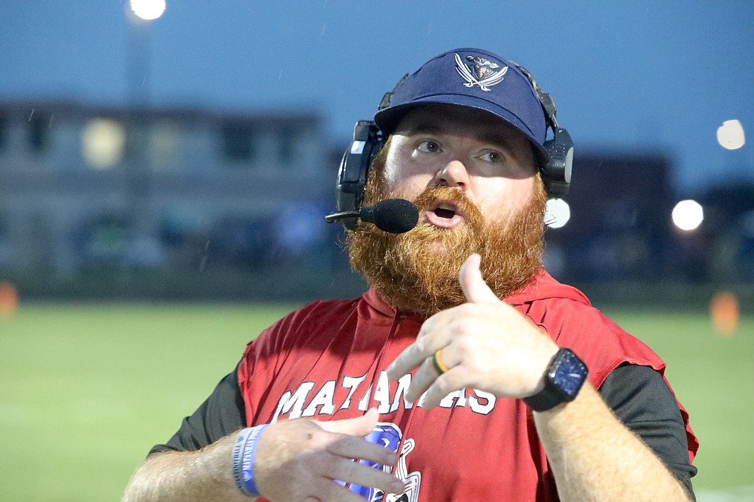 Matanzas head coach Matt Forrest talks to coaches in the press box on the headphones in a game against Deltona on Sept. 5. File photo by Brent Woronoff