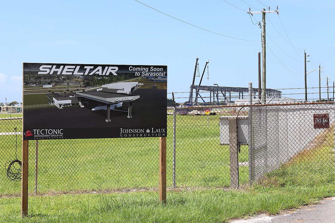 Construction is underway for fixed-base operator Sheltair. The grass area between the sign and the construction is the future location of Swiss-based aircraft manufacturer Pilatus.