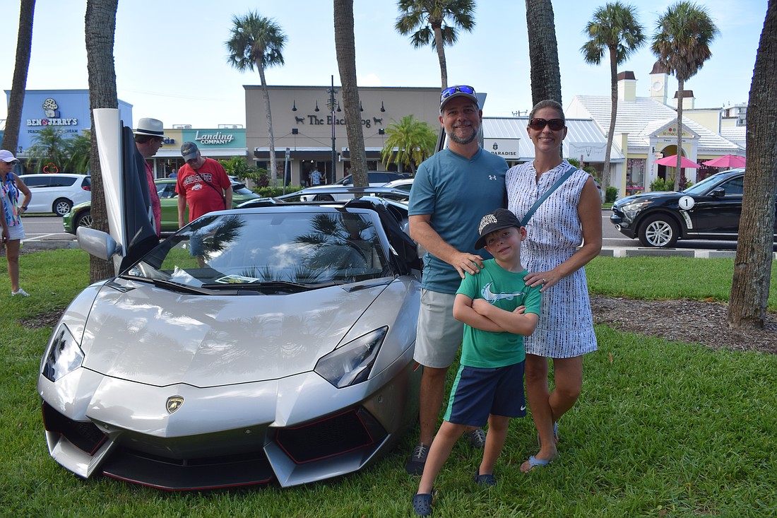 Brian, Holly and Austin Highfield at Exotic Cars on the Circle.