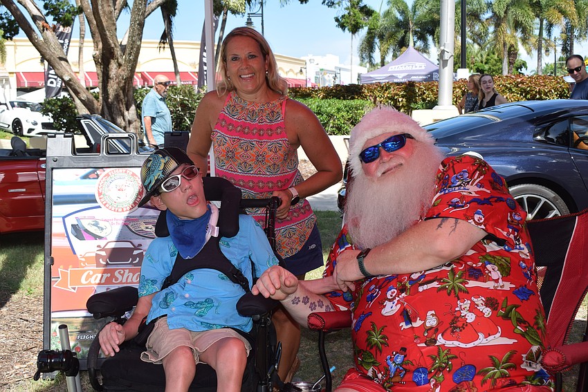 Cassiel Gonzalez, Alyssa Born and Tony Wilburn at Exotic Cars on the Circle.