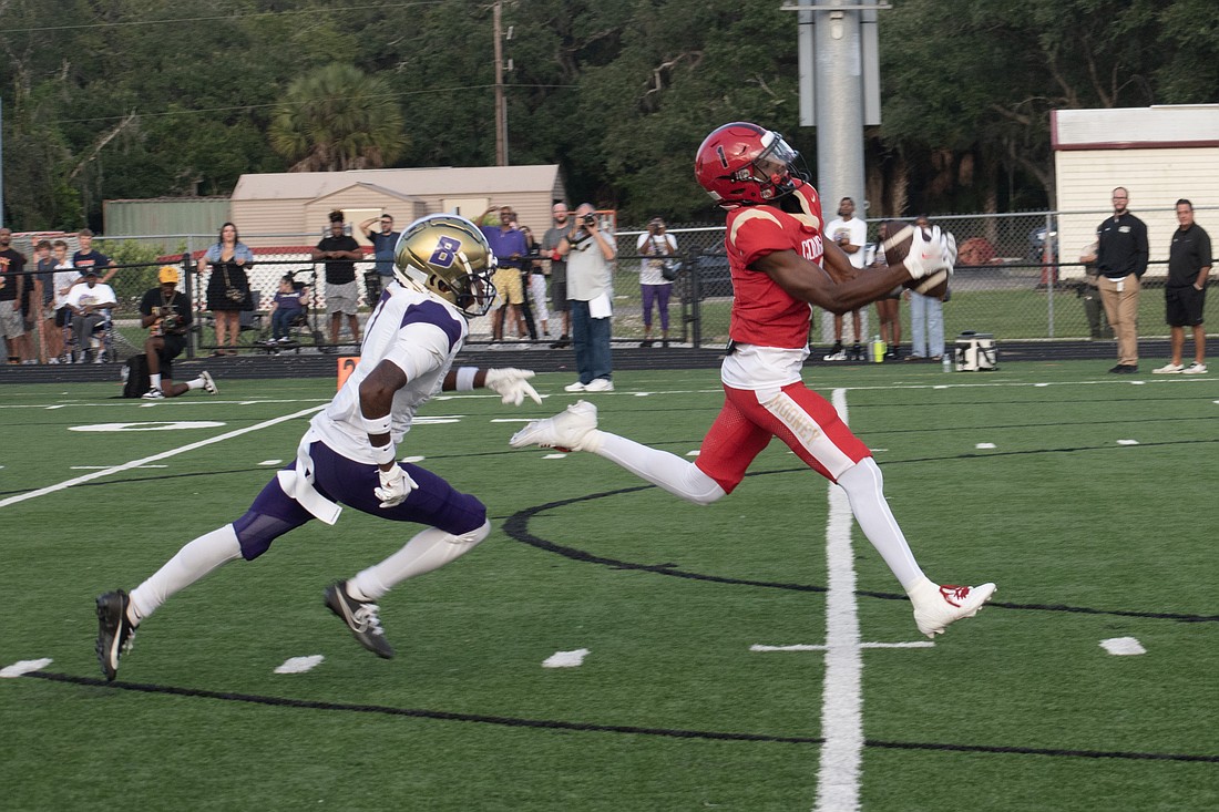 Cardinal Mooney's RJ Mosley catches a deep ball from Devin Mignery against Booker High in the fall 2024 season. Mosley would score on the play.