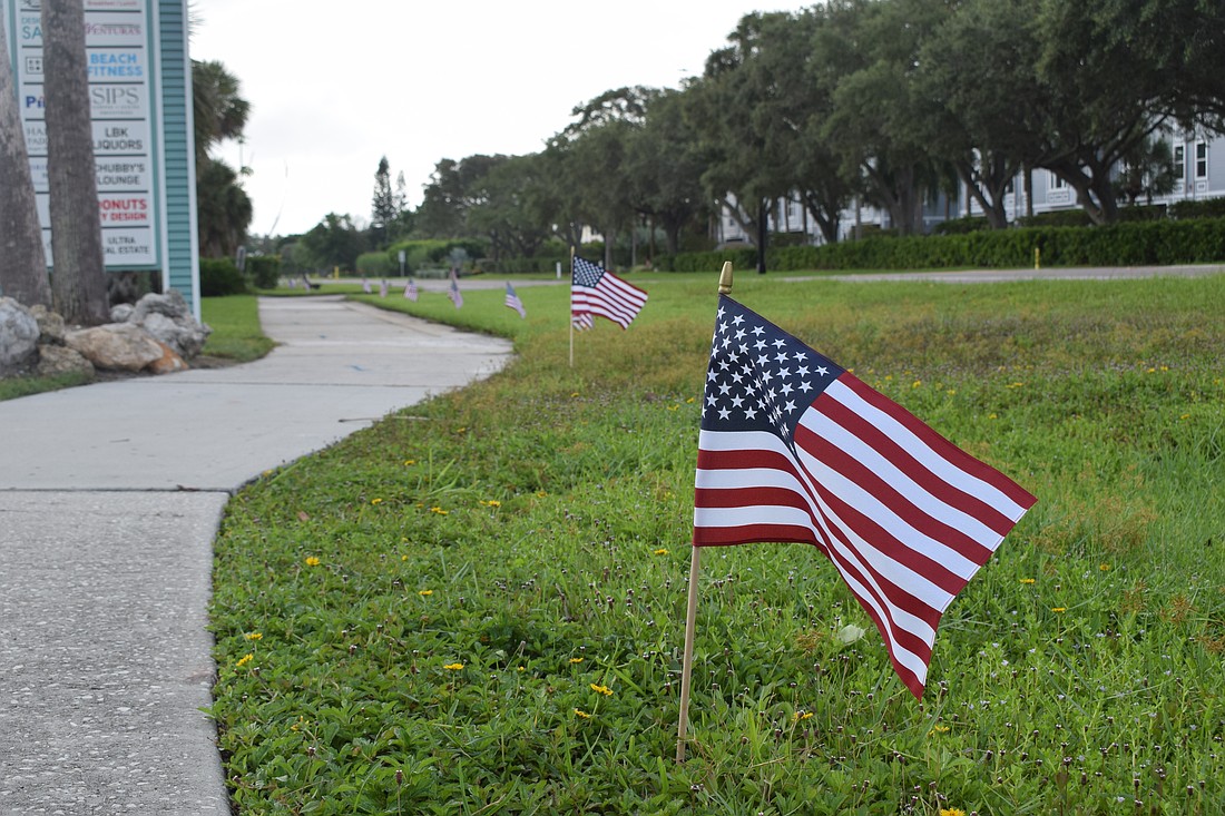 Eight employees of the Longboat Key Public Works Department lined up American flags along Gulf of Mexico Drive in honor of Sept. 11.