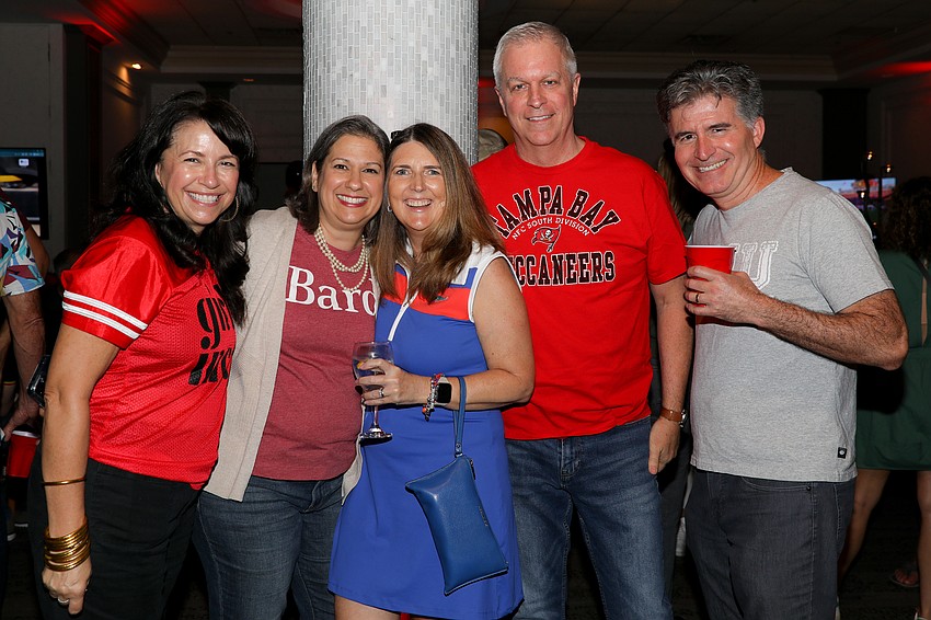 Kay Mathers, Gilda Dennis, Jen Maglio, Scott Dennis and Altom Maglio arrive ready to enjoy the epic tailgate party being held inside Michael's on East in support of Girls Inc.