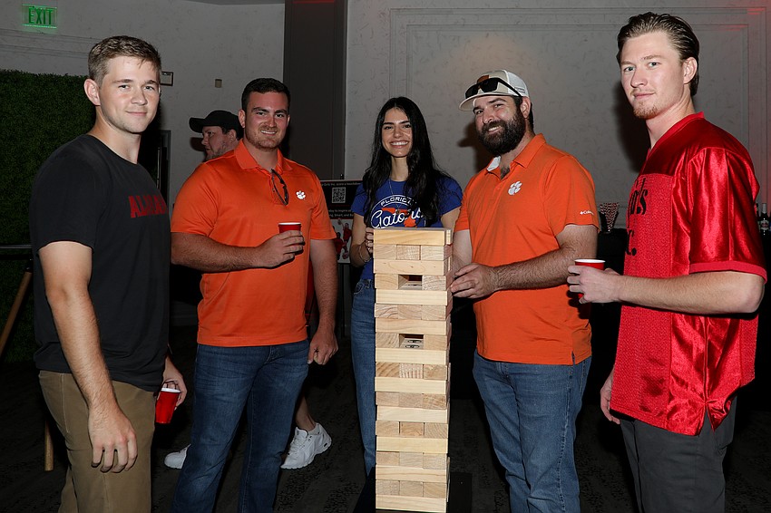 Trey Tobias, Aidan Alderman, Dani Oliva, Graham Devitt and Sam Stringer enjoy a friendly game of Jenga.