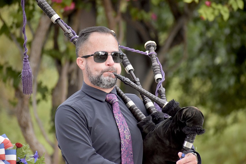 USF Alumnus Ross Allen plays bagpipes.