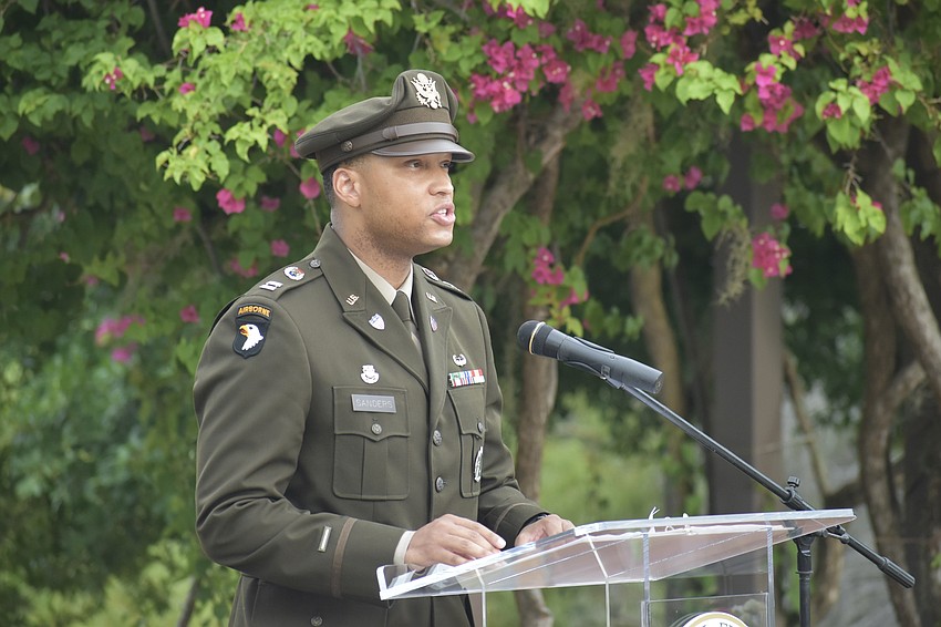 United States Army Captain Markevius Sanders reads 