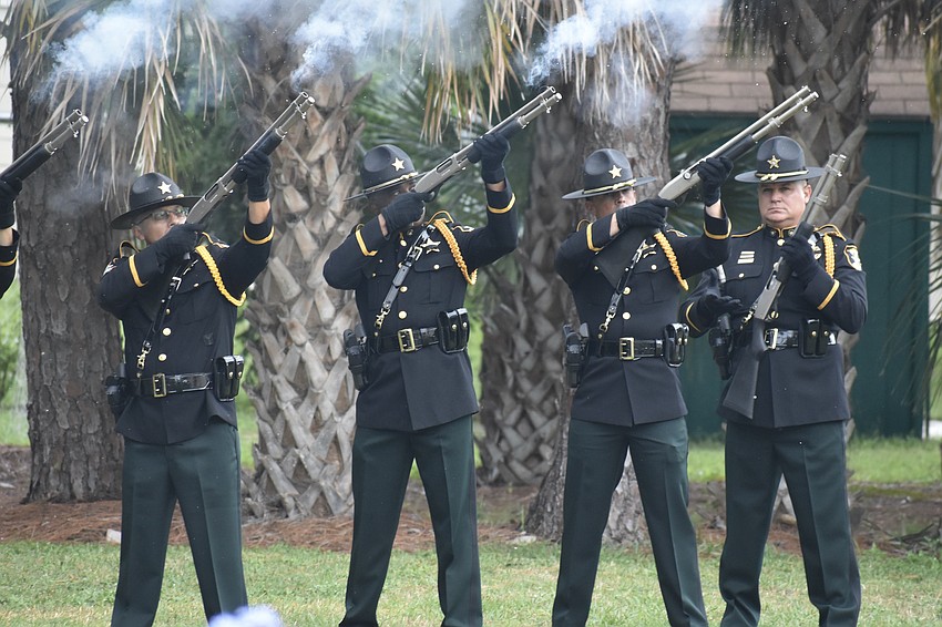 Deputy Johnny Moreira, Detective Dwight Mattis, Detective Vincent Ovchar and Sgt. Nathan King of the Sarasota County Sheriff's Office perform the 21-Gun Salute.