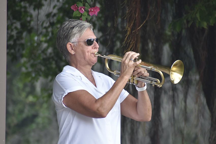 Julie Waters of Braden River Brass plays Taps.