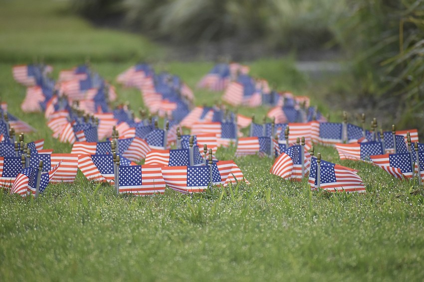 Students at USF Sarasota-Manatee laid flags on the ground throughout the campus, on Saturday, in remembrance of Sept. 11, 2001.
