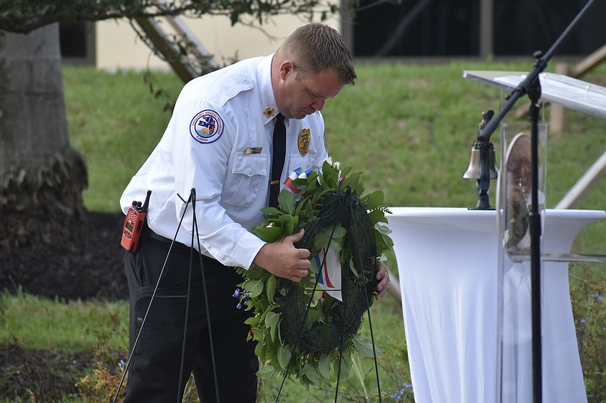 Fire Chief Jason Hackley of SRQ Sarasota-Bradenton International Airport, lays a wreath to commemorate 9/11.