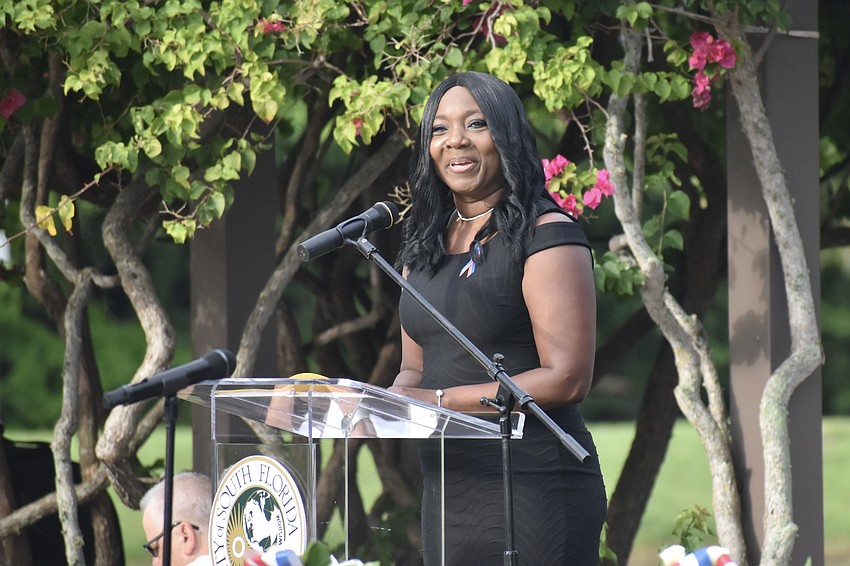 Principal LaShawn Frost of Booker Middle School introduces her students during the remembrance.