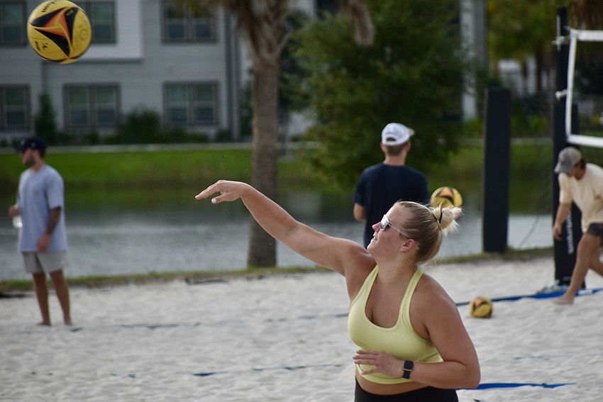 Bradenton resident Elise Monroe serves.