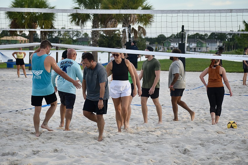 Players line up to shake hands after the game.